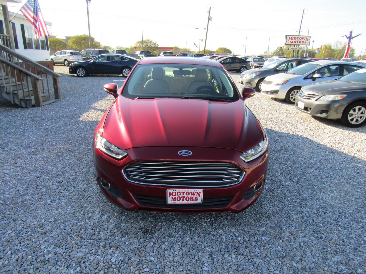 2015 Red Ford Fusion SE (3FA6P0HDXFR) with an 1.5L L4 DOHC 16V engine, Automatic transmission, located at 15016 S Hwy 231, Midland City, AL, 36350, (334) 983-3001, 31.306210, -85.495277 - Photo#1